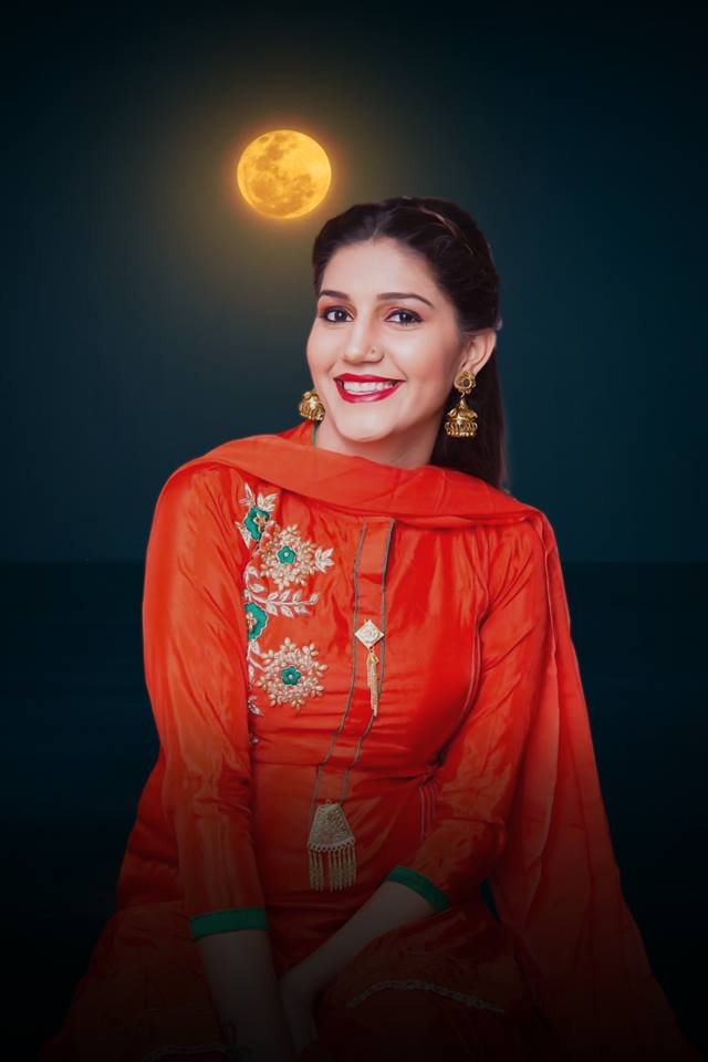 Sapna Choudhary's HD Photos in Orange Dress